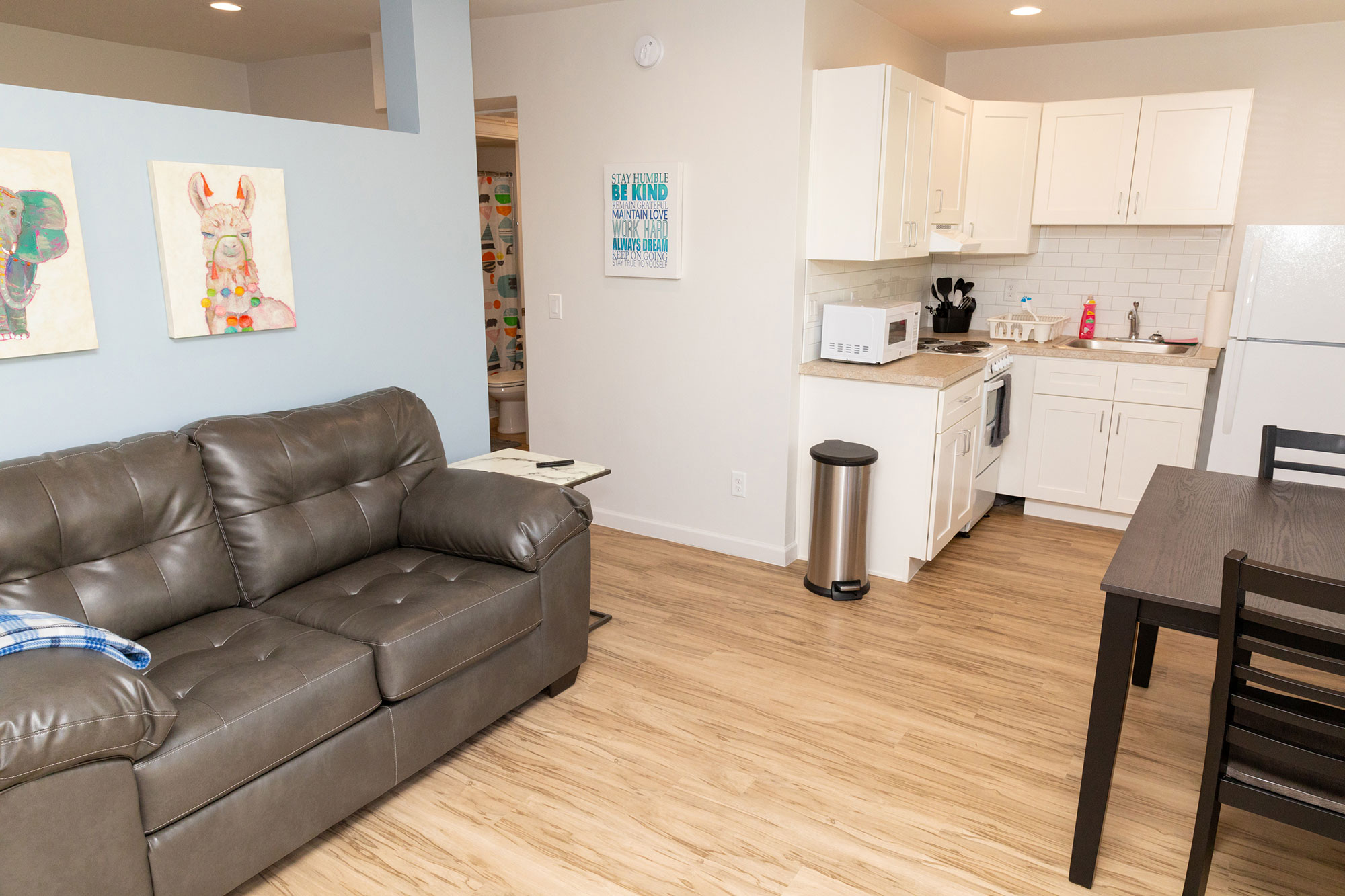 Living Room With a Couch and a Table at Connie Hillman Family House Transitional Living for Women.