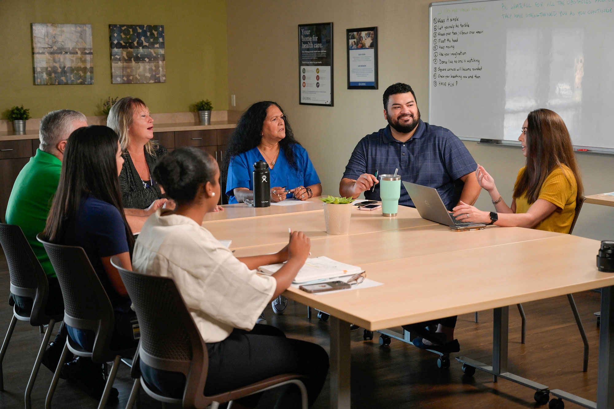 A Group of CODAC Intensive Outpatient Treatment Participants Sitting Around a Table.