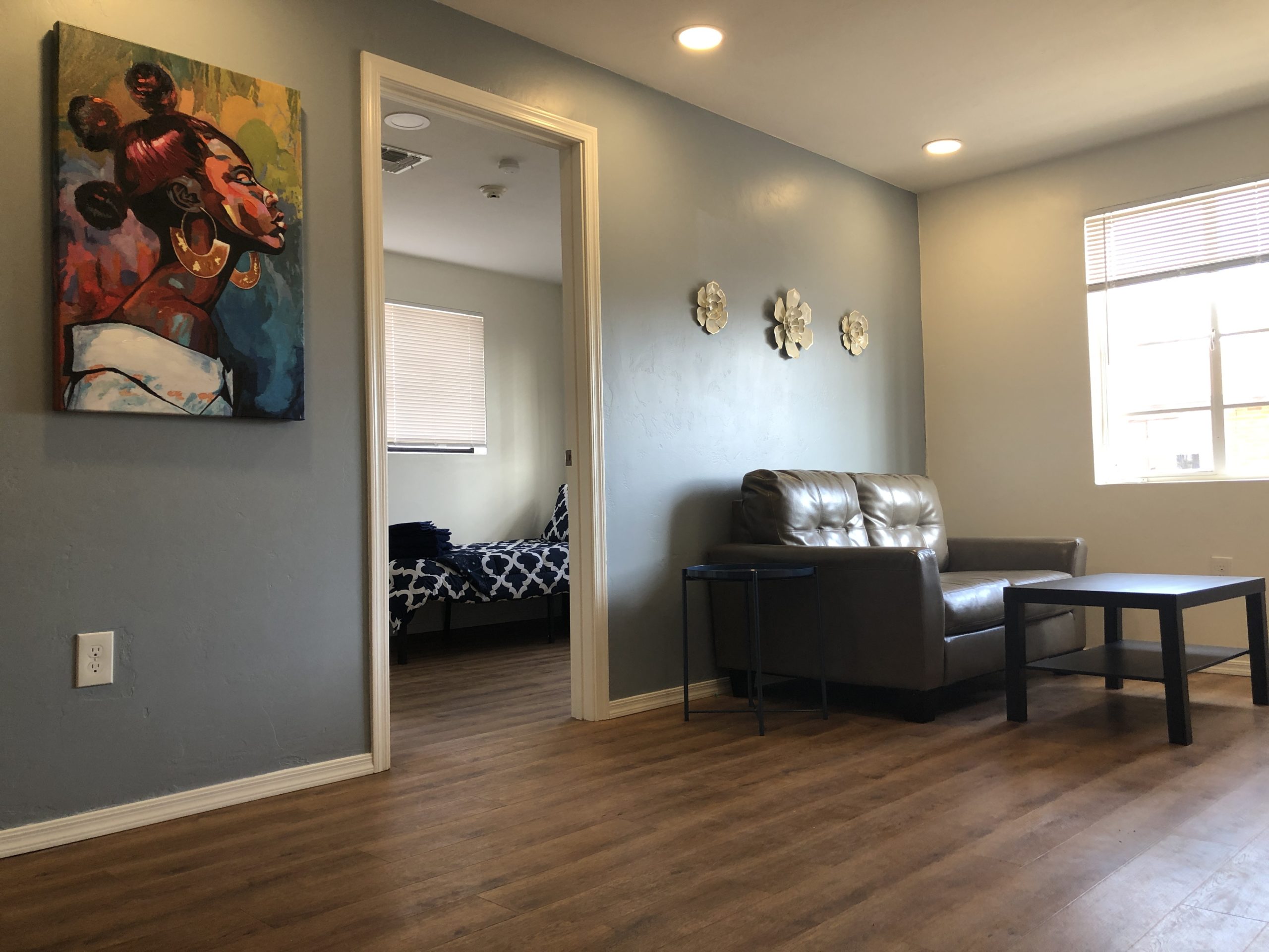 Living Room With a Couch and a Table at Transitional Living House for Women.