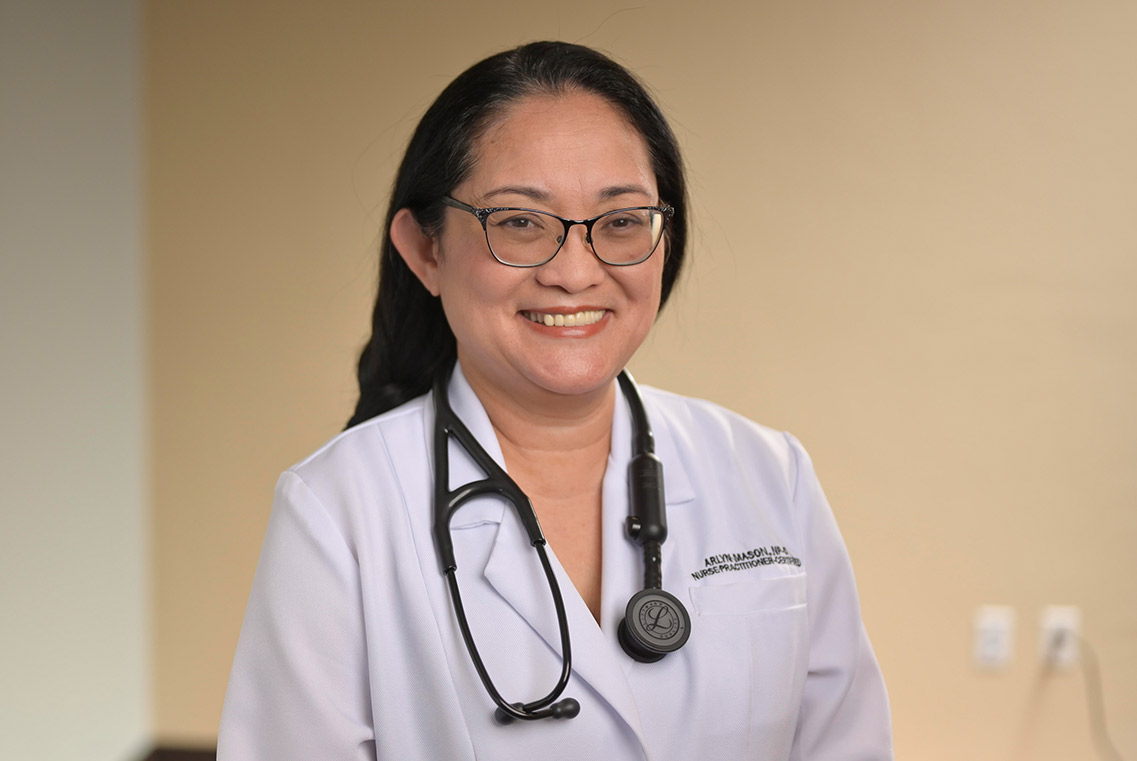 CODAC behavioral health staff member smiles at camera. CODAC behavioral health staff member smiles at camera.