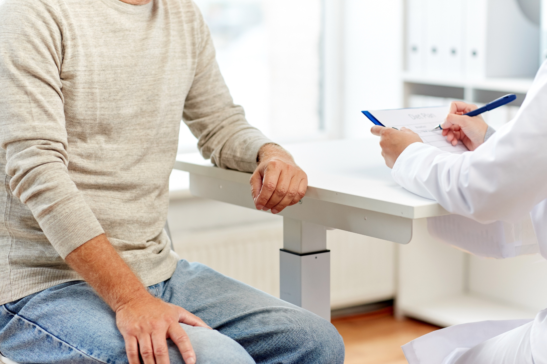 Untitled design (22) Primary Care Provider with patient