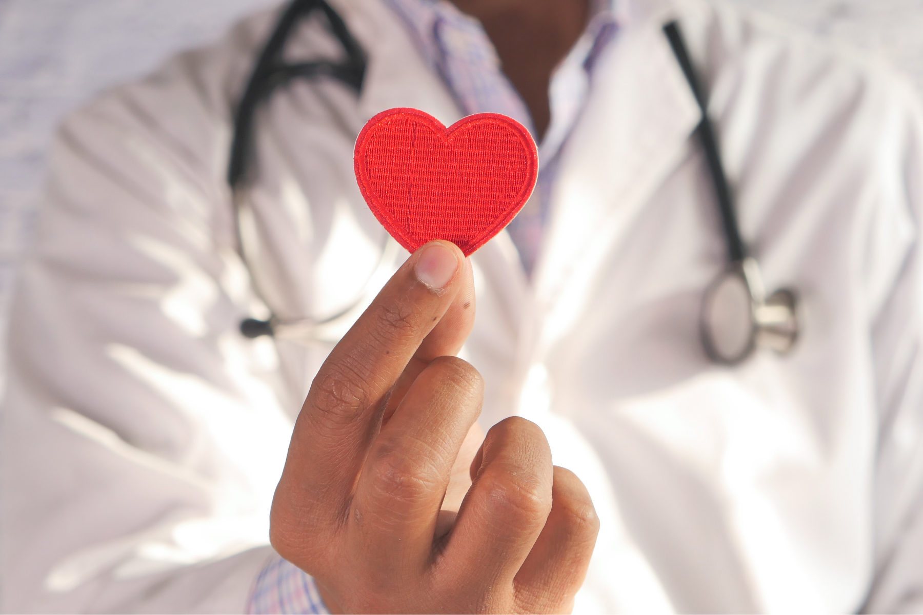 Untitled design (25) Doctor holding a heart